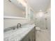 Updated bathroom with stylish vanity, elegant mirror, and glass-enclosed shower at 313 13Th St, Butner, NC 27509
