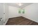 Bright bedroom with hardwood floors, ceiling fan, and natural light at 313 13Th St, Butner, NC 27509