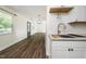 Open kitchen view showcasing updated features, modern finishes and sightlines to living area at 313 13Th St, Butner, NC 27509