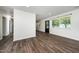 Open-concept living space with modern flooring, seamlessly connecting living and dining areas for entertaining at 313 13Th St, Butner, NC 27509