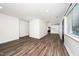 Spacious living area with clear sightlines into the kitchen for a modern feel, and updated flooring throughout at 313 13Th St, Butner, NC 27509
