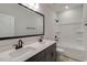 Contemporary bathroom featuring a double vanity and bathtub-shower combination at 343 Augusta Pond Way # 176, Raleigh, NC 27603