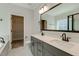 Bright bathroom featuring a double vanity, sleek fixtures, and a well-organized walk-in closet at 343 Augusta Pond Way # 176, Raleigh, NC 27603