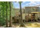 Exterior shot of the back of a two-story home with wooden decks at 3622 Colchester St # 17, Durham, NC 27707