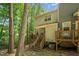 A view of the back exterior of the house showing backyard decks and wooded area at 3622 Colchester St # 17, Durham, NC 27707