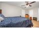 Warm bedroom featuring a decorative metal bed frame and wood-look laminate flooring at 3622 Colchester St # 17, Durham, NC 27707