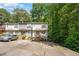 Charming townhome featuring neutral siding, wood stairs, and dedicated parking spaces at 3622 Colchester St # 17, Durham, NC 27707