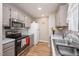 Functional kitchen features stainless steel appliances and neutral-toned cabinetry at 3622 Colchester St # 17, Durham, NC 27707