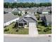 This home boasts a manicured lawn, inviting curb appeal, and a desirable neighborhood setting at 405 Bramble Ln, Clayton, NC 27527