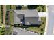 Stunning aerial view of the home showcasing its spacious backyard, patio area, and well-maintained roof at 405 Bramble Ln, Clayton, NC 27527