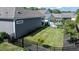 Beautiful backyard featuring manicured lawn, planting beds, and privacy fencing for serene outdoor living at 405 Bramble Ln, Clayton, NC 27527