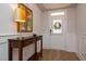 Welcoming entryway features wainscoting, wood floors, and a stylish console table at 405 Bramble Ln, Clayton, NC 27527
