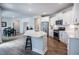 Bright kitchen with stainless steel appliances and a spacious island open to the dining area at 405 Bramble Ln, Clayton, NC 27527
