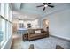 Cozy living room open to a modern kitchen featuring stainless steel appliances at 405 Bramble Ln, Clayton, NC 27527