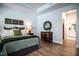 Spacious bedroom featuring tray ceilings and an ensuite bathroom at 405 Bramble Ln, Clayton, NC 27527