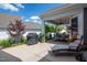 Large patio area with outdoor grill, lounge chair and dining set, perfect for entertaining at 405 Bramble Ln, Clayton, NC 27527