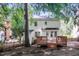 Backyard view of a two-story home with a deck and fenced yard, offering a private outdoor space at 4416 Lancashire Dr, Raleigh, NC 27613