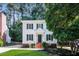 Charming two-story home with black shutters, landscaped front yard, and brick-lined entry at 4416 Lancashire Dr, Raleigh, NC 27613