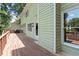 Exterior view of the wooden back deck with green siding at 4733 Royal Troon Dr, Raleigh, NC 27604