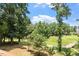 Beautiful backyard view of the golf course and wooded landscape at 4733 Royal Troon Dr, Raleigh, NC 27604