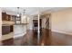 Open basement featuring hardwood floors, fireplace, and wet bar at 4733 Royal Troon Dr, Raleigh, NC 27604