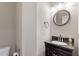 Half bathroom featuring a dark vanity and granite countertop at 4733 Royal Troon Dr, Raleigh, NC 27604