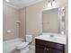 Full bathroom with ceramic tile shower, dark vanity, and contemporary design at 4733 Royal Troon Dr, Raleigh, NC 27604