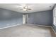 Large bedroom featuring neutral carpet and a ceiling fan at 4733 Royal Troon Dr, Raleigh, NC 27604