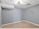 Cozy carpeted bedroom with gray walls and decorative ceiling light fixture at 4733 Royal Troon Dr, Raleigh, NC 27604