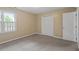 Bedroom with neutral walls and carpet and a large closet at 4733 Royal Troon Dr, Raleigh, NC 27604