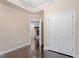 Bedroom with hardwood floors, a fireplace, and a double door closet at 4733 Royal Troon Dr, Raleigh, NC 27604