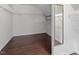 Walk-in closet with wood floors and ample shelving space at 4733 Royal Troon Dr, Raleigh, NC 27604