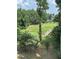 Scenic view of a golf course featuring a bridge and lush green landscaping at 4733 Royal Troon Dr, Raleigh, NC 27604