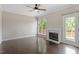 Bright living room with fireplace and access to an outdoor deck at 4733 Royal Troon Dr, Raleigh, NC 27604