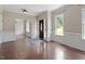 Bright and airy living room with beautiful hardwood floors, white trim and wainscoting at 4733 Royal Troon Dr, Raleigh, NC 27604