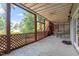 Screened patio area with outdoor dining table and ceiling fan at 4733 Royal Troon Dr, Raleigh, NC 27604