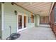 Covered porch area with concrete flooring leading to backyard area at 4733 Royal Troon Dr, Raleigh, NC 27604