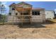 New home construction showing the partially completed back deck and foundation in a residential community at 49 Cloudview Ct, Pittsboro, NC 27312