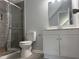 Modern bathroom featuring a glass-enclosed shower and a white vanity at 50 Leah Ln, Louisburg, NC 27549