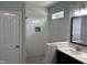 Bright bathroom with white tile shower and dark vanity at 50 Leah Ln, Louisburg, NC 27549