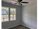 Cozy bedroom with ceiling fan, double windows and wood-look flooring at 50 Leah Ln, Louisburg, NC 27549