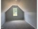 Bright and airy room with neutral carpet and a large window at 50 Leah Ln, Louisburg, NC 27549