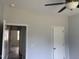 Neutral bedroom featuring ceiling fan, ample closet space and wood-look flooring at 50 Leah Ln, Louisburg, NC 27549