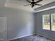 A bedroom with a ceiling fan and windows at 50 Leah Ln, Louisburg, NC 27549