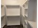 A walk-in closet features built-in shelving at 50 Leah Ln, Louisburg, NC 27549