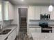 Modern kitchen with stainless steel appliances, granite countertops, and ample cabinet space at 50 Leah Ln, Louisburg, NC 27549