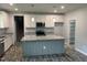 Modern kitchen with granite counters, kitchen island and stainless-steel appliances at 50 Leah Ln, Louisburg, NC 27549