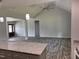 Bright open-plan living room and kitchen area featuring wood-look flooring at 50 Leah Ln, Louisburg, NC 27549