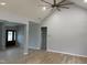 Bright and airy living room with vaulted ceilings, gray walls, and a contemporary ceiling fan at 50 Leah Ln, Louisburg, NC 27549