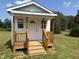 Outbuilding with wooden porch in backyard at 50 Leah Ln, Louisburg, NC 27549